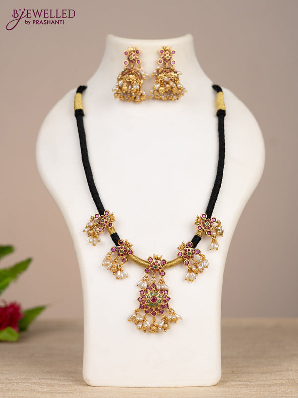 Black thread necklace with kemp stones and pearl & golden beads hangings