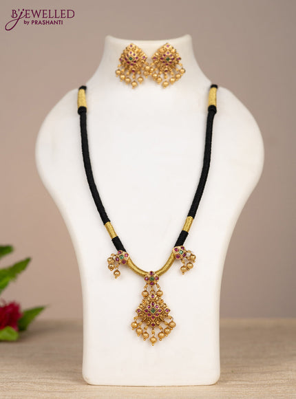Black thread necklace with kemp stones and golden beads hangings