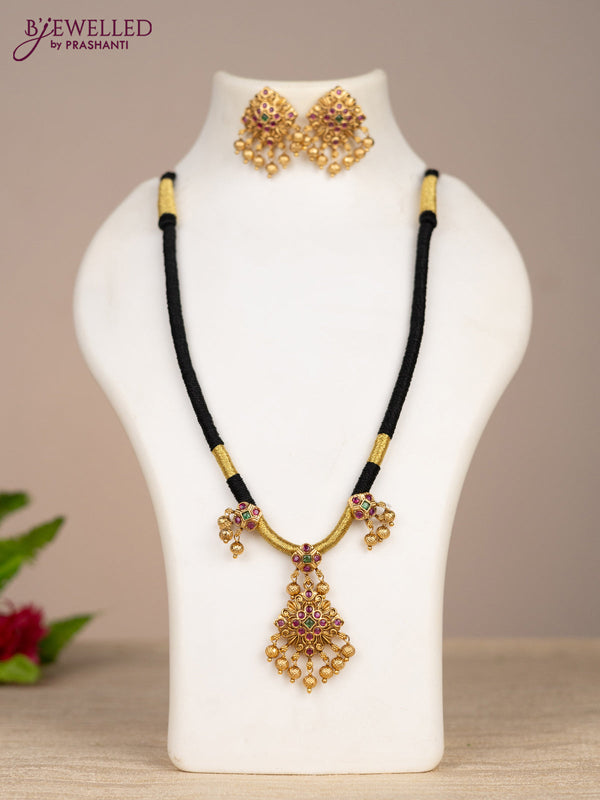 Black thread necklace with kemp stones and golden beads hangings
