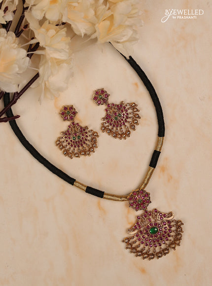 Black thread floral design with kemp stones and golden beads hanging