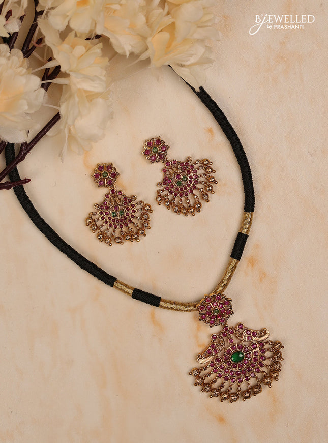 Black thread floral design with kemp stones and golden beads hanging