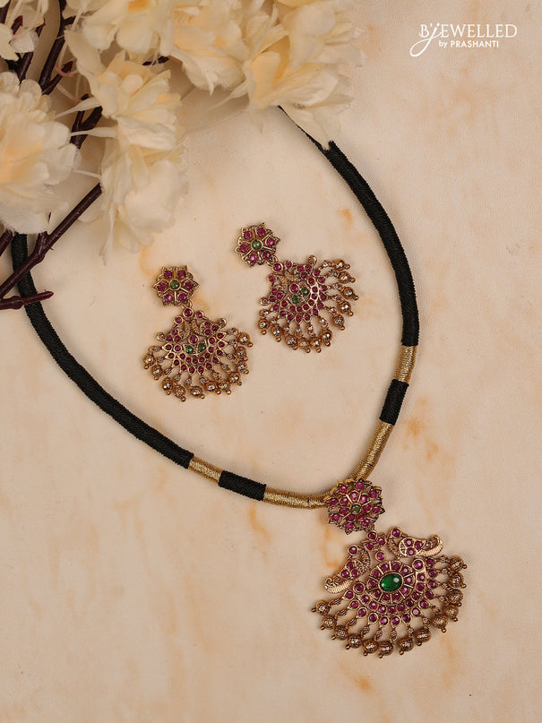 Black thread floral design with kemp stones and golden beads hanging