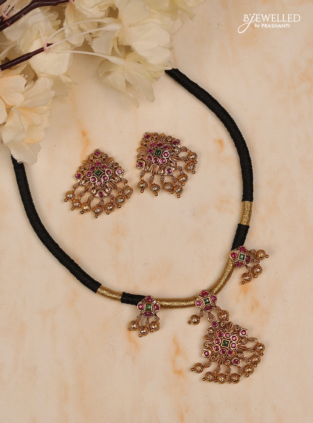 Black thread square design with kemp stones and golden beads hanging