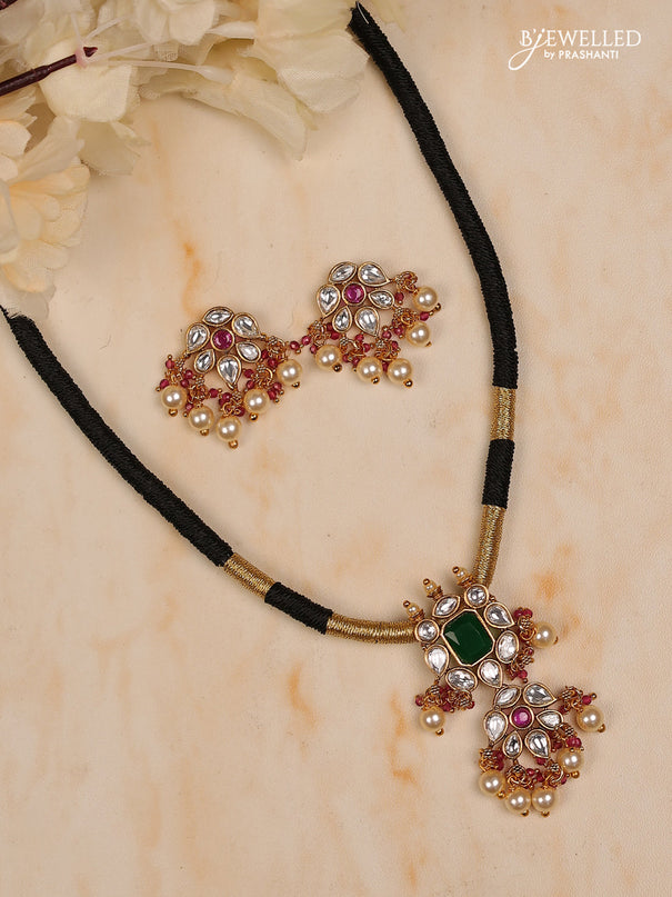 Black thread necklace iwth white kundan stones ,red & green stones and pearl hanging