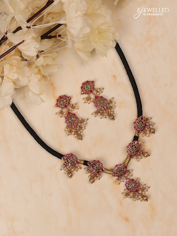 Black thread floral design with kemp stones and golden & pearl beads hanging