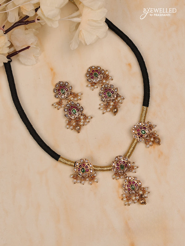 Black thread floral design with kemp stones and golden & pearl beads hanging
