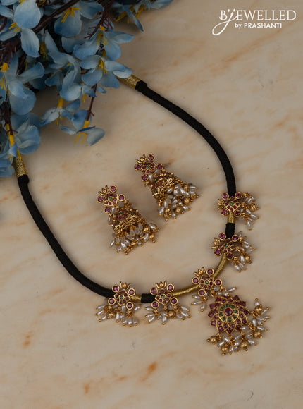 Black thread necklace with floral pendant in multicolor kemp stones and rice pearl hanging