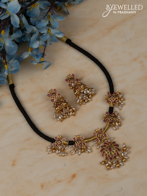 Black thread necklace with floral pendant in multicolor kemp stones and rice pearl hanging