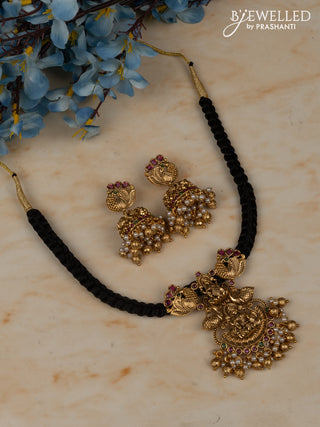 Black thread necklace with lakshmi pendant in multicolor kemp stones and golden ball hanging