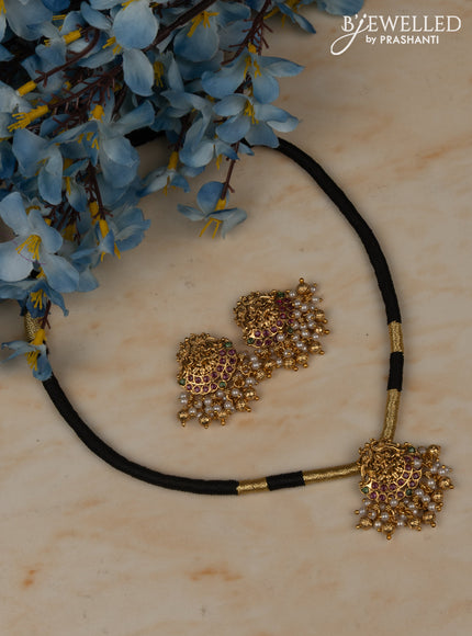 Black thread necklace with lakshmi pendant in multicolor kemp stones and golden ball hanging