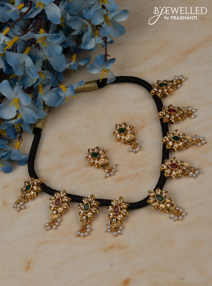 Black thread necklace with floral pendant in white stones and pearl hanging