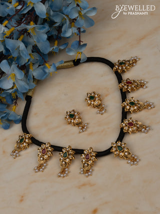 Black thread necklace with floral pendant in white stones and pearl hanging