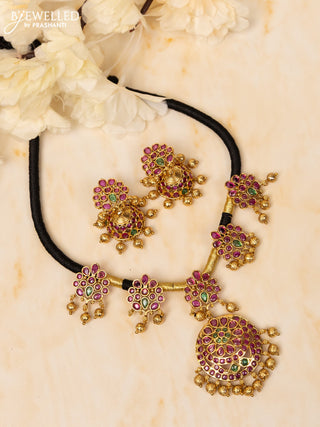 Black thread necklace with kemp stones and golden beads hangings