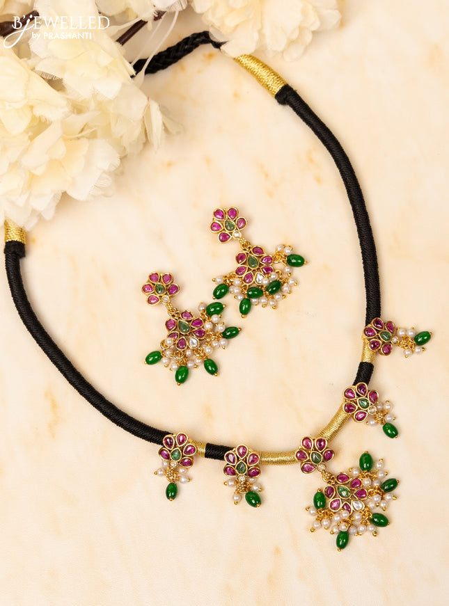 Black thread necklace with kemp and kundan stones in pearl & green beads hangings