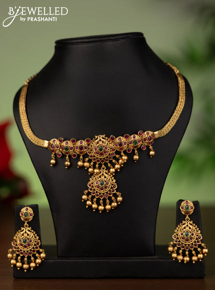 Antique attigai necklace with kemp stones and golden beads hanging