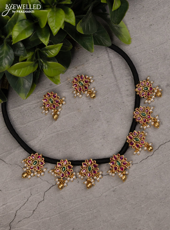 Black thread necklace with kemp stones and pearl & golden beads hanging