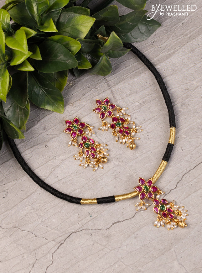 Black thread necklace with kemp stones and pearl & golden beads hanging