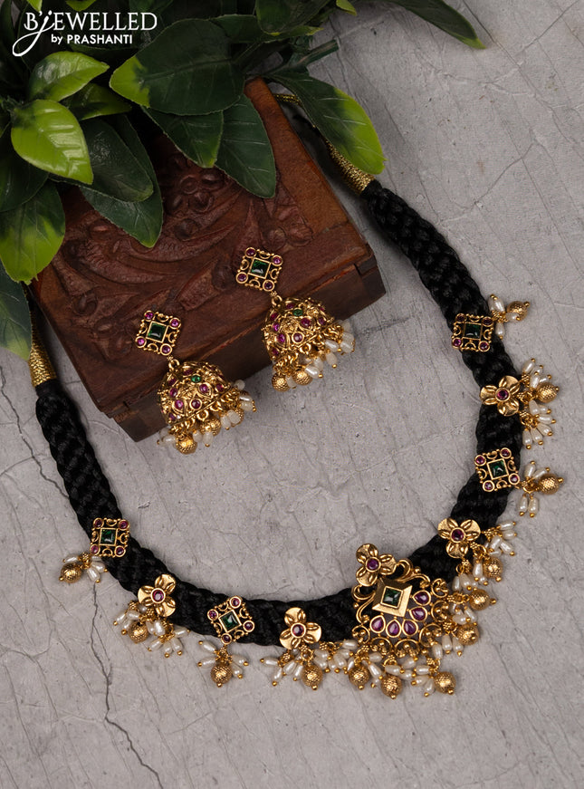 Black thread necklace with kemp stones and pearl & golden beads hangings