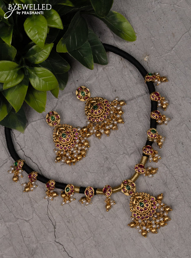 Black thread necklace with kemp stones and pearl & golden beads hangings