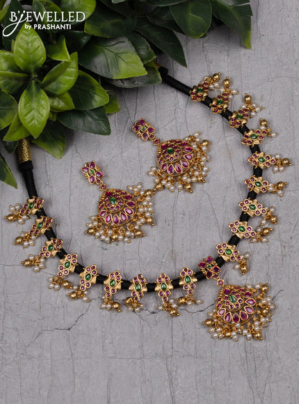 Black thread necklace with kemp stones and pearl & golden beads hanging