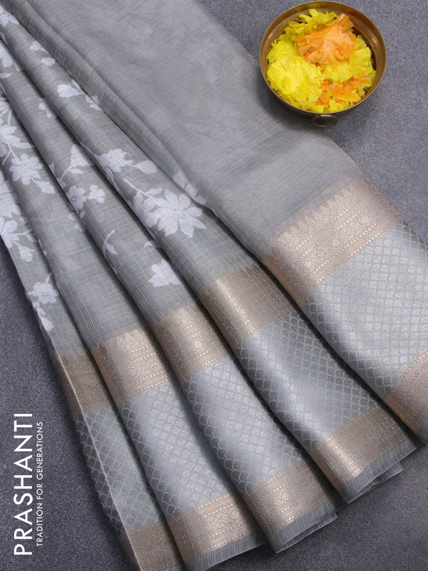 Kota saree pastel grey with allover floral prints and rettapet zari woven border