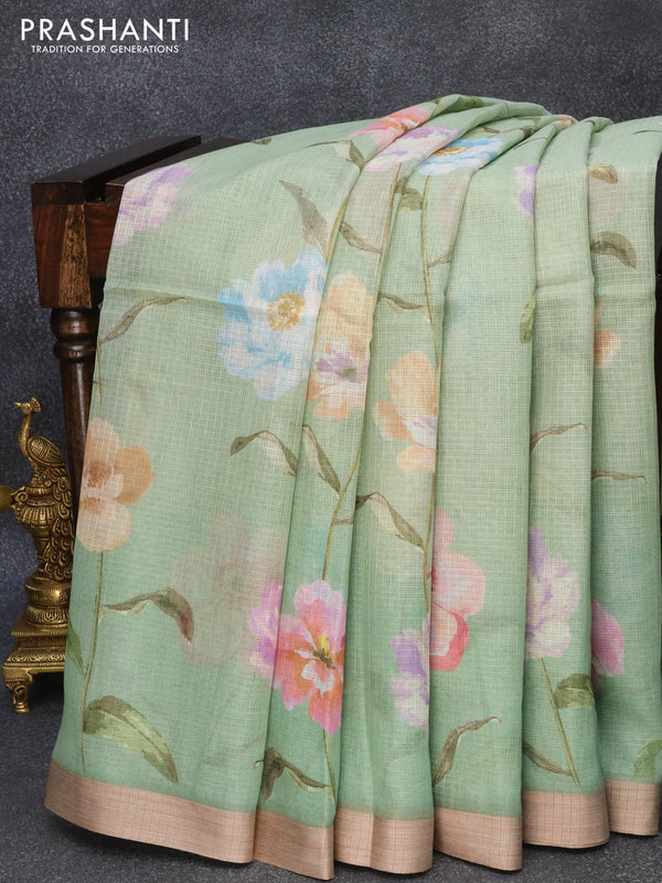 Kota silk cotton saree pastel green   with allover floral prints and simple border