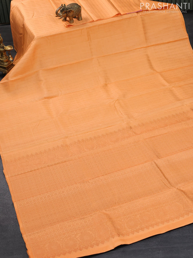 Pure kanjivaram silk saree pale orange with allover copper zari weaves in borderless style