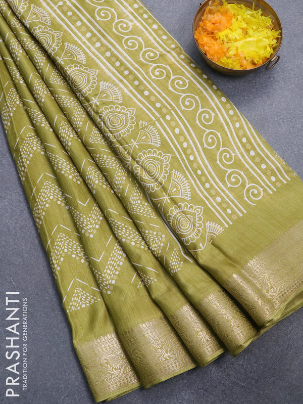 Semi dola saree light green shade with allover prints and zari woven border