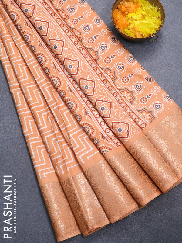 Semi dola saree pale orange with allover zig zag prints and zari woven border