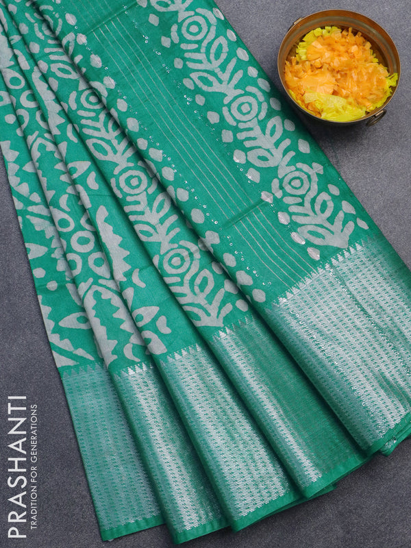 Semi tussar saree teal blue with allover batik prints & sequin work pallu and long silver zari woven border