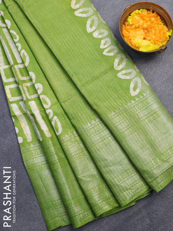 Semi tussar saree light green with allover batik prints & sequin work pallu and long silver zari woven border