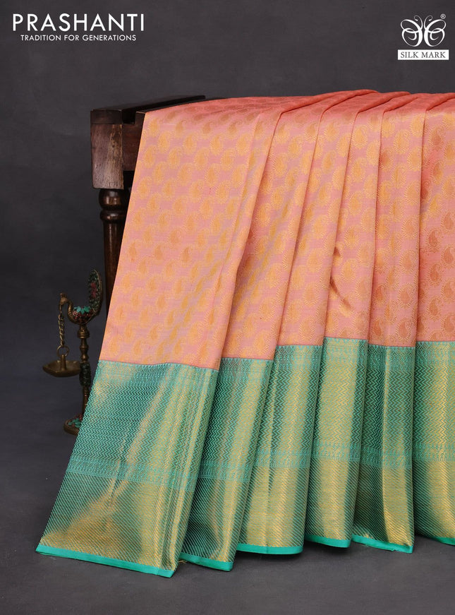 Pure kanchipuram silk saree peach pink and teal blue with allover zari woven paisley butta weaves and long zari woven border