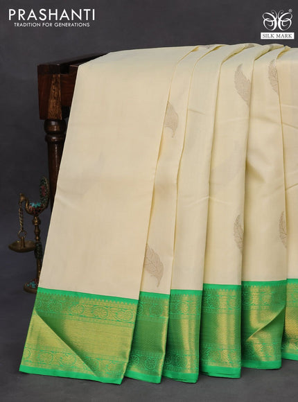 Pure kanchipuram silk saree off white and green with zari woven leaf buttas and zari woven border