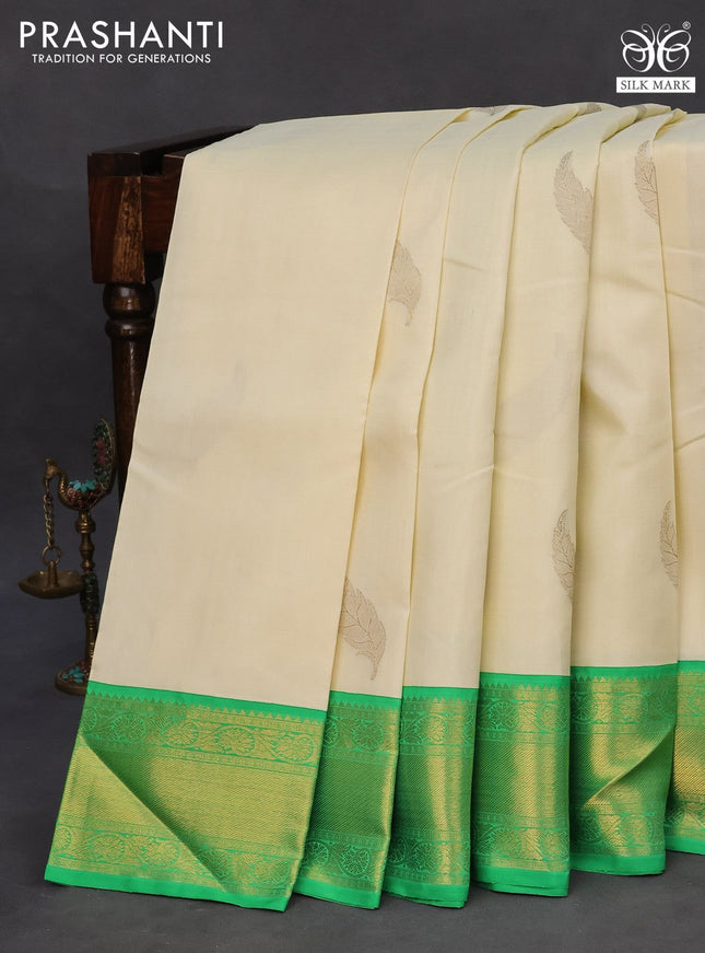 Pure kanchipuram silk saree off white and green with zari woven leaf buttas and zari woven border