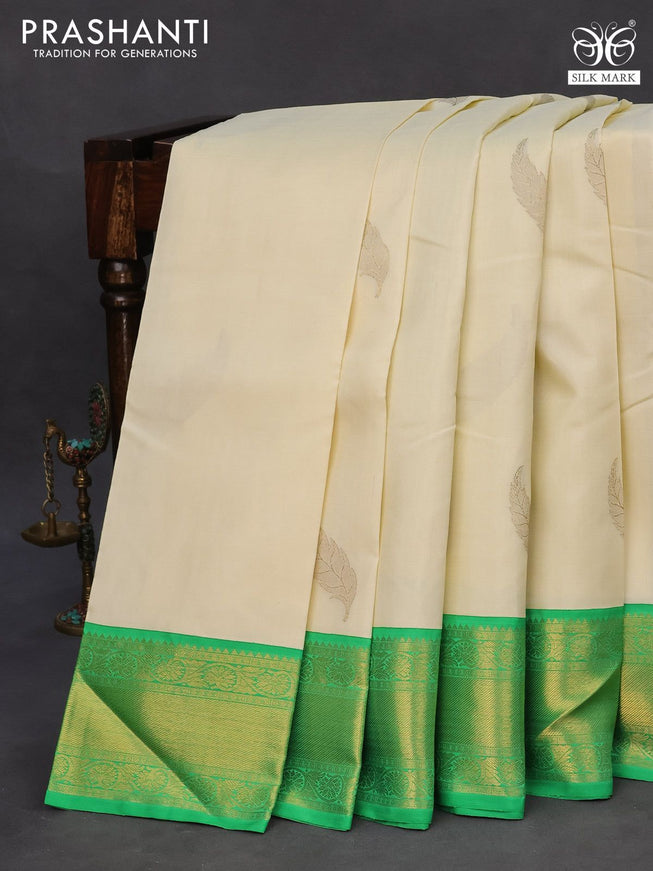 Pure kanchipuram silk saree off white and green with zari woven leaf buttas and zari woven border