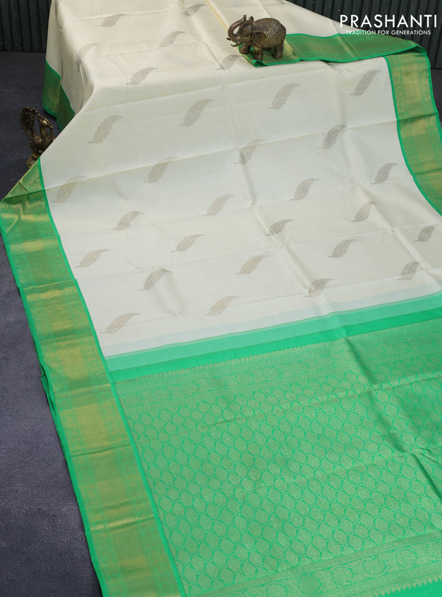 Pure kanchipuram silk saree off white and green with zari woven leaf buttas and zari woven border