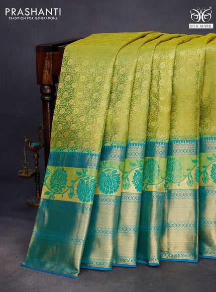 Pure kanchipuram silk saree dual shade of lime green and cs blue with allover zari woven brocade weaves and long thread & zari woven border