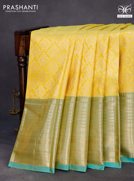 Pure kanchipuram silk saree yellow and dual shade of teal blue with allover zari woven brocade weaves and zari woven border