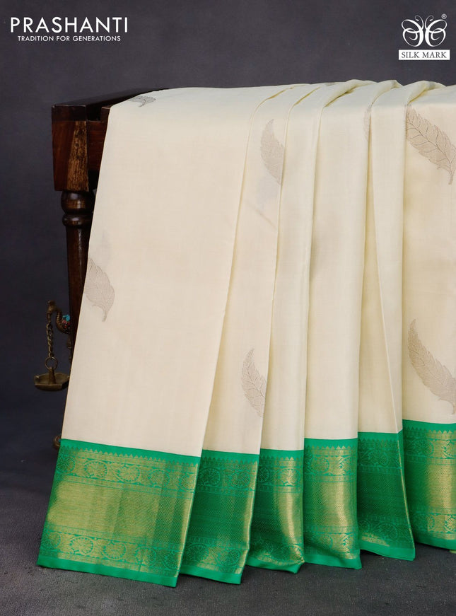 Pure kanchipuram silk saree off white and green with zari woven leaf buttas and zari woven border