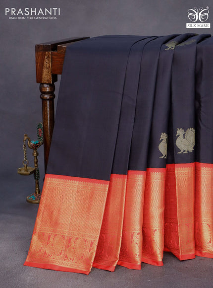 Pure kanchipuram silk saree black and orange with annam zari woven buttas and long zari woven korvai border