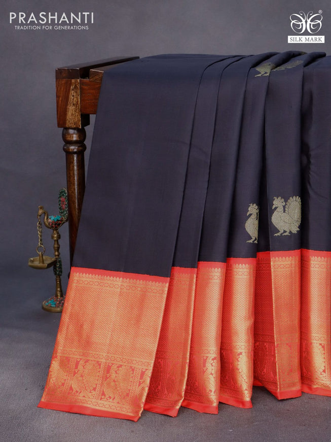 Pure kanchipuram silk saree black and orange with annam zari woven buttas and long zari woven korvai border