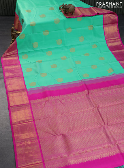 Pure kanchipuram silk saree teal green shade and pink with zari woven buttas and long zari woven korvai border