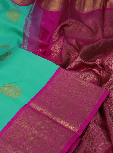 Pure kanchipuram silk saree teal green shade and pink with zari woven buttas and long zari woven korvai border