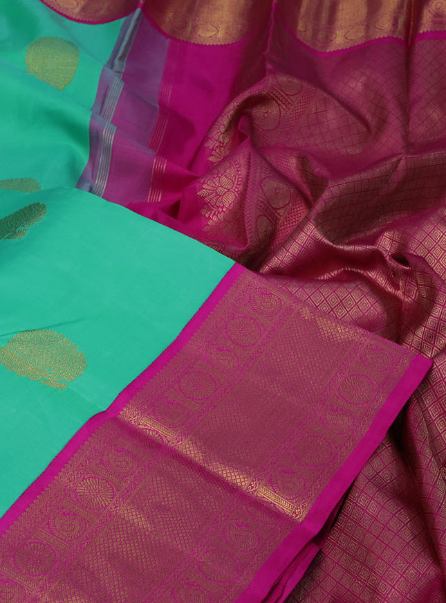 Pure kanchipuram silk saree teal green shade and pink with zari woven buttas and long zari woven korvai border