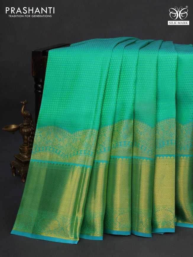 Pure kanchipuram silk saree dual shade of teal green and teal blue with allover self emboss and long zari woven border