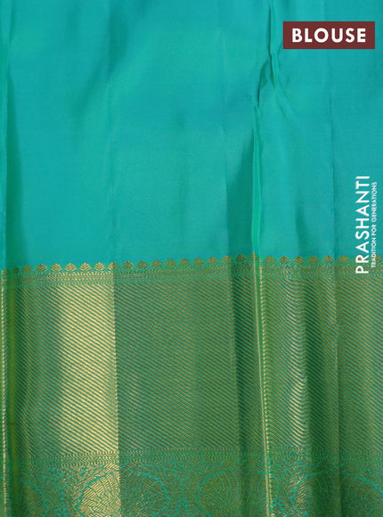 Pure kanchipuram silk saree dual shade of teal green and teal blue with allover self emboss and long zari woven border