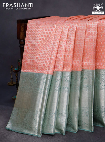 Pure kanchipuram silk saree peach shade and pastel green with allover silver zari woven brocade weaves and long silver zari woven border