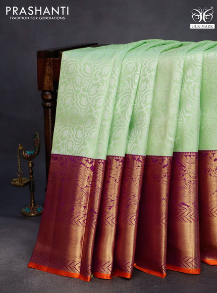 Pure kanchipuram silk saree pista green and violet with allover silver zari weaves and long annam zari woven korvai border