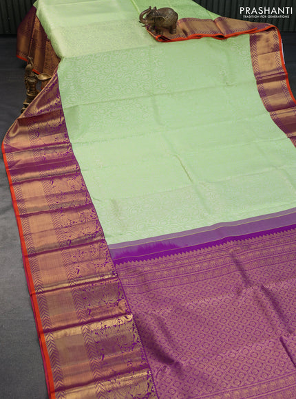 Pure kanchipuram silk saree pista green and violet with allover silver zari weaves and long annam zari woven korvai border