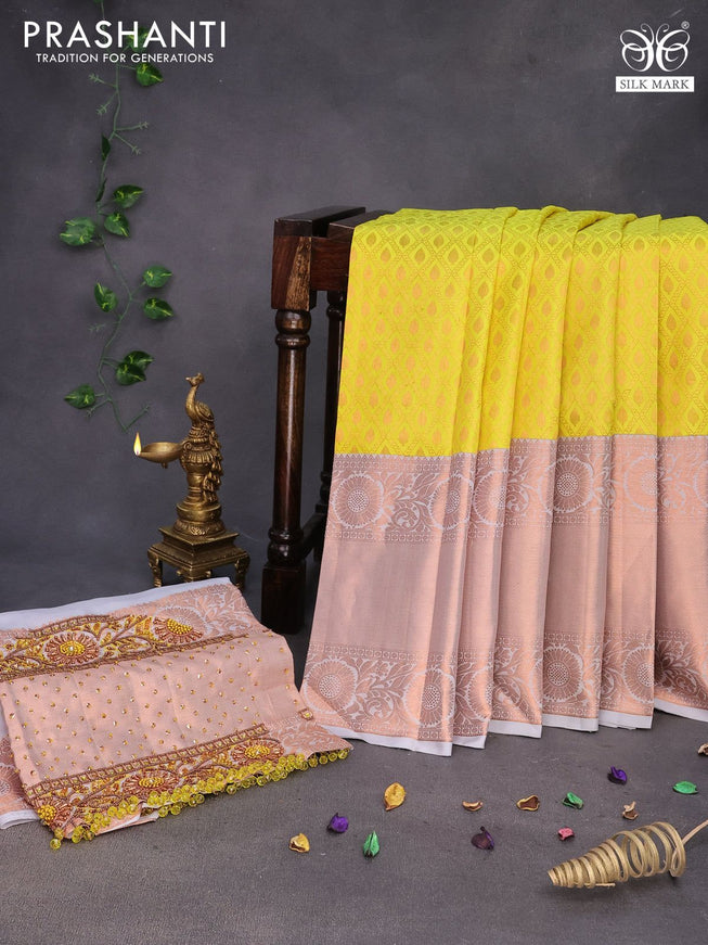 Pure kanchipuram silk saree lime yellow and pastel grey with allover zari woven brocade weaves and long copper zari woven border & embroidery work blouse